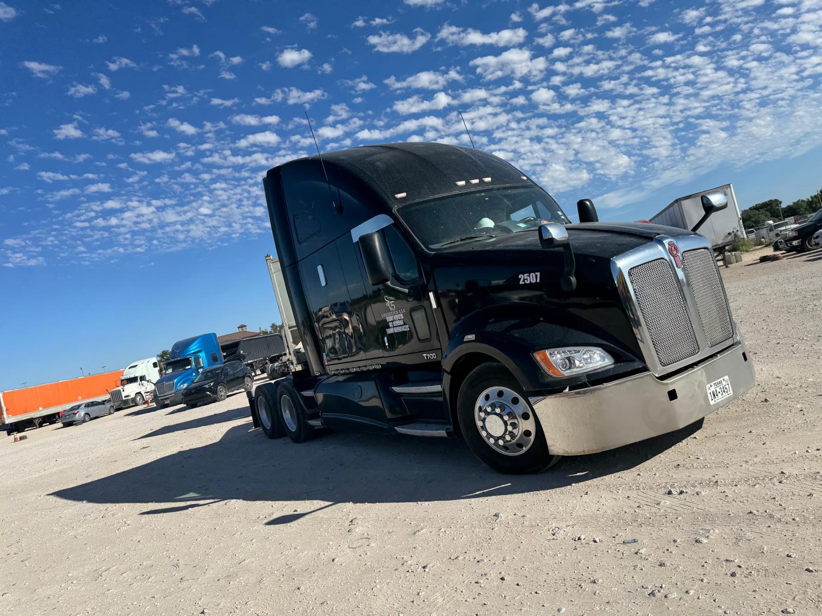 Black Kenworth T700 logistics tractor